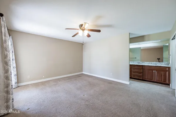 a view of an empty room with a bathroom