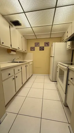 a view of a kitchen with storage and utility