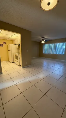 a view of a livingroom with an empty space and a sink