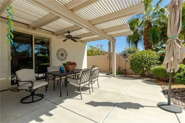 a view of a dinning room with a table and chairs