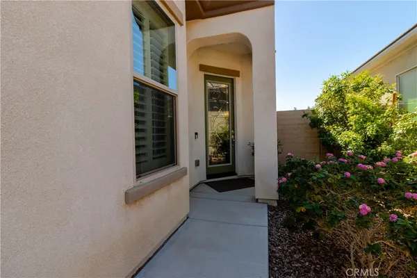 a view of house with backyard