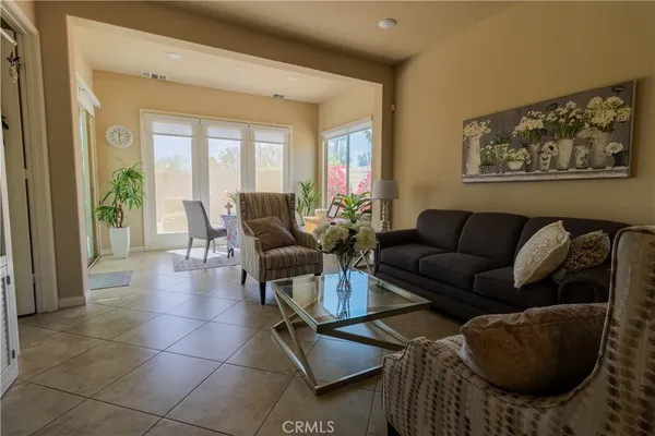 a living room with furniture and a large window