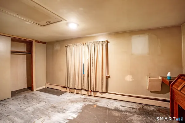 a view of an empty room with a window