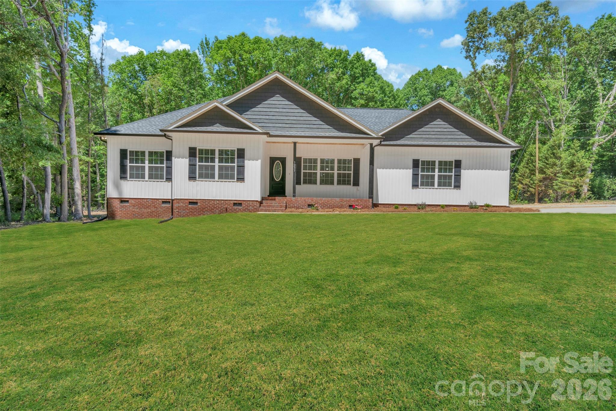 0 Cimmeron Road Lancaster, SC 29720 - Photo 2 of 29 a front view of a house with a yard