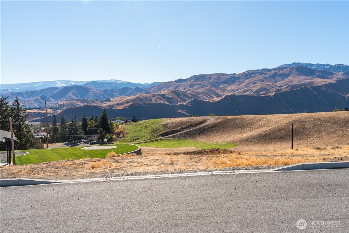 21 Margaret Lane Wenatchee, WA 98801 - Photo 1 of 16 a view of a house with a yard and a large pool