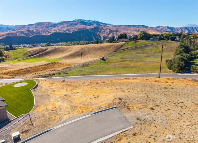 a view of an ocean and a mountain