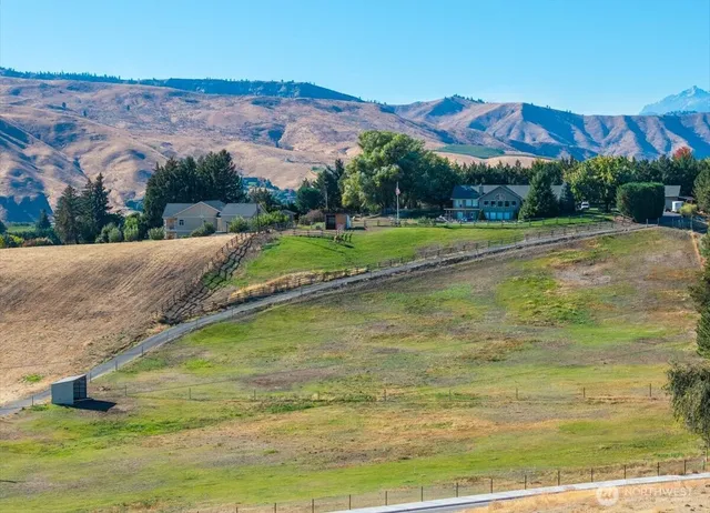 a view of a house with a big yard