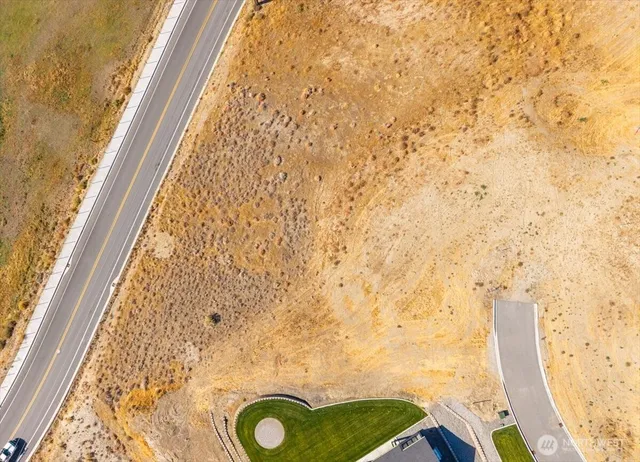 a view of a balcony with floor to ceiling windows with wooden floor