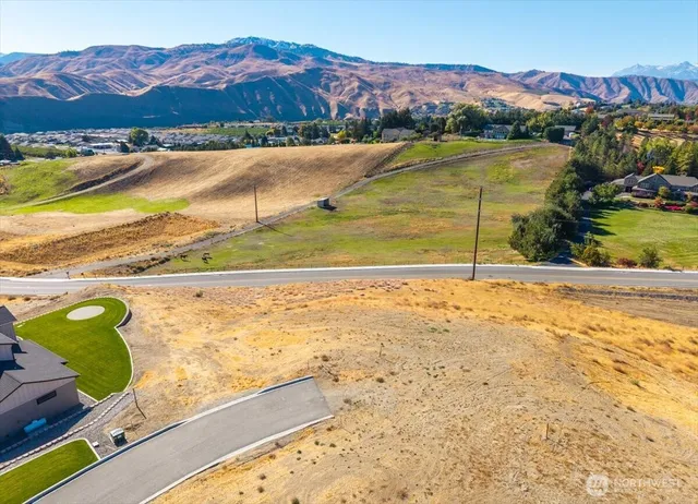 a view of an ocean and a mountain