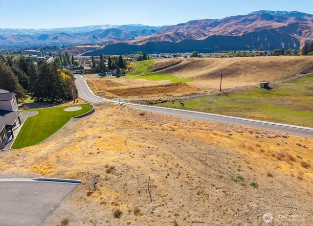 a view of a backyard with a lake view