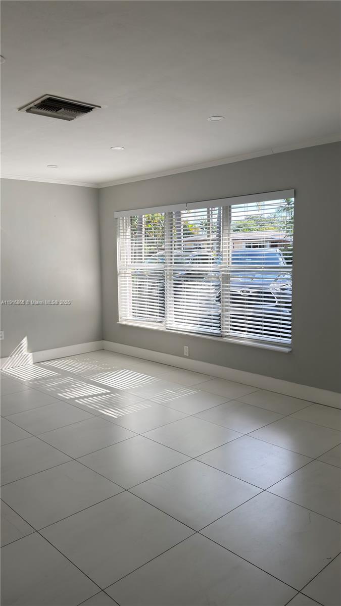 1577 Northeast 48th Court Oakland Park, FL 33334 - Photo 7 of 21 a view of an empty room with a window
