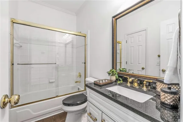 a bathroom with a sink vanity tub and shower