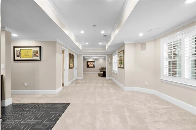 an aerial view of residential houses with outdoor space and trees