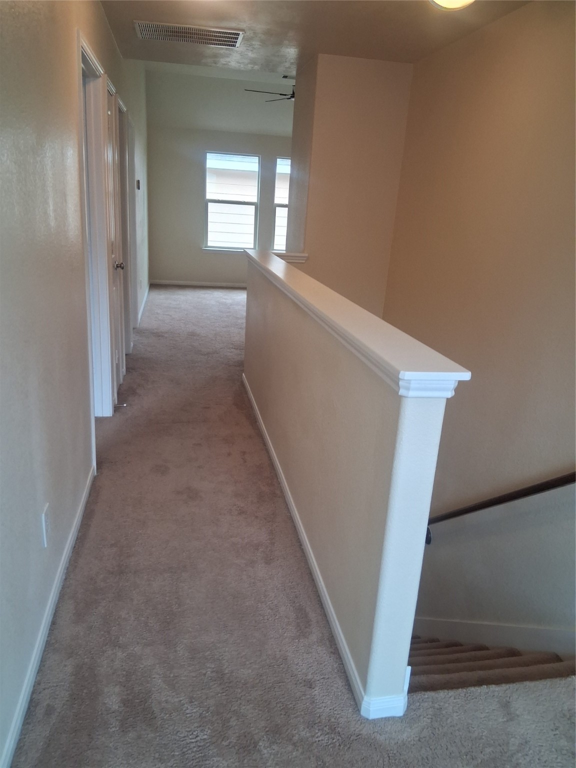 13610 Spectacled Bear Lane Crosby, TX 77532 - Photo 20 of 32 a view of hallway with stairs
