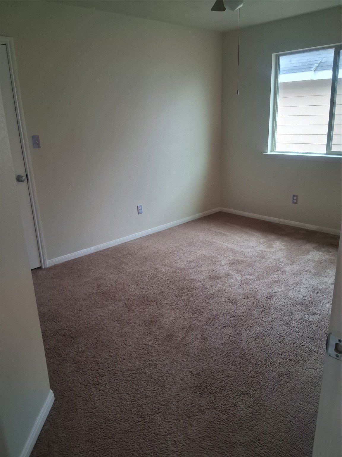 13610 Spectacled Bear Lane Crosby, TX 77532 - Photo 23 of 32 an empty room with a window