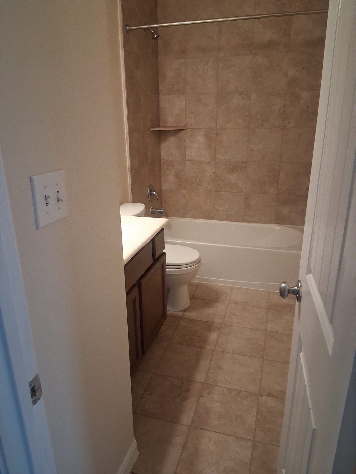 13610 Spectacled Bear Lane Crosby, TX 77532 - Photo 25 of 32 a bathroom with a granite countertop sink toilet and shower