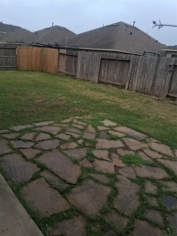 a view of a backyard with a tub