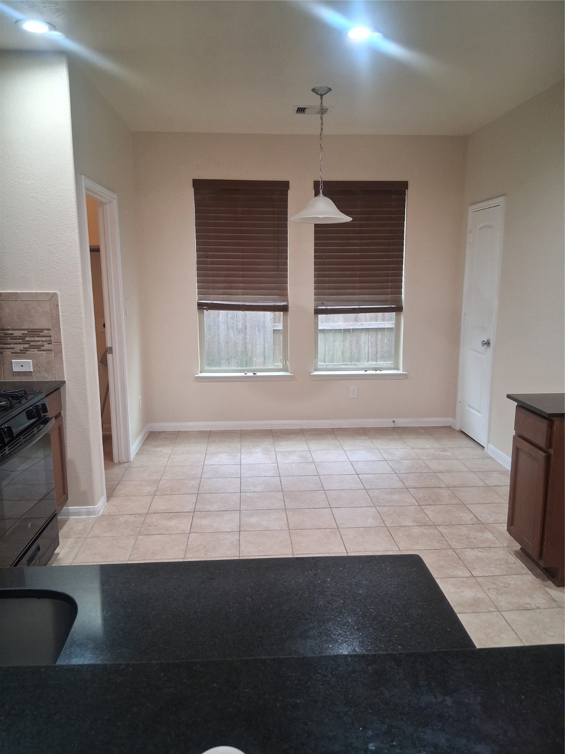 13610 Spectacled Bear Lane Crosby, TX 77532 - Photo 7 of 32 a view of an empty room with a window