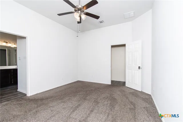 a view of a big room with carpet