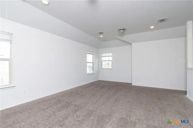 an empty room with windows