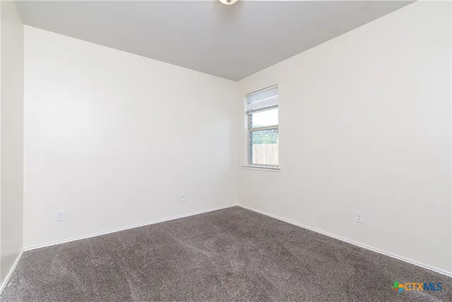 a view of a window in an empty room