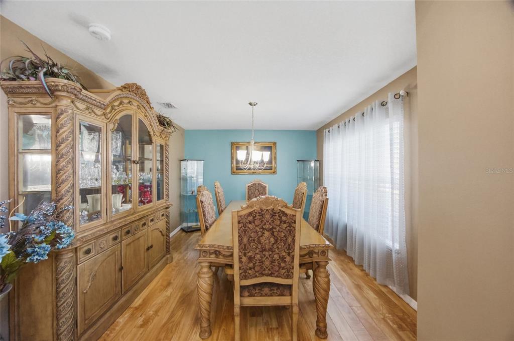 4517 Southeast 28th Street Ocala, FL 34480 - Photo 11 of 43 a view of a hallway with furniture and wooden floor