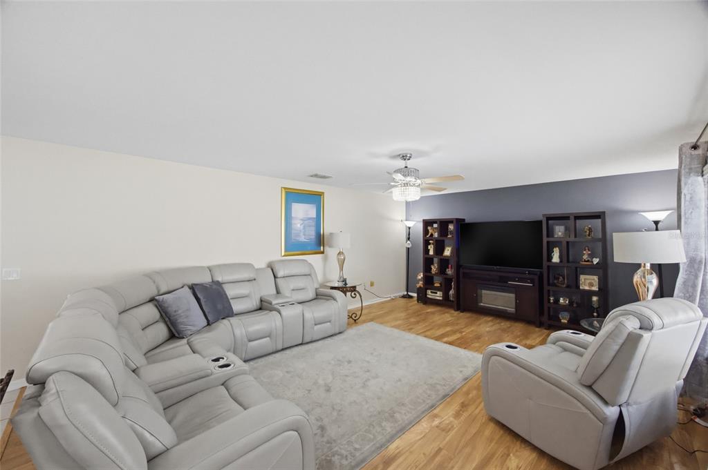 4517 Southeast 28th Street Ocala, FL 34480 - Photo 12 of 43 a living room with furniture and a flat screen tv