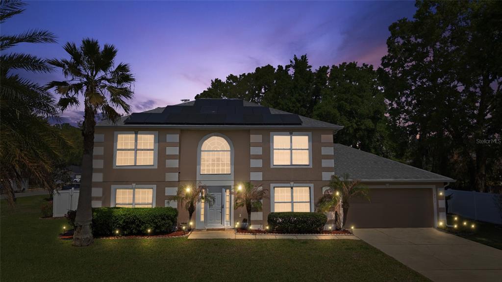 4517 Southeast 28th Street Ocala, FL 34480 - Photo 2 of 43 a front view of a house with a yard