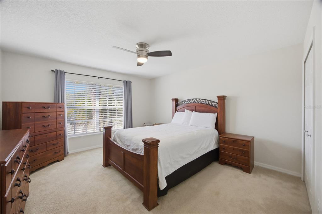 4517 Southeast 28th Street Ocala, FL 34480 - Photo 23 of 43 a bedroom with a bed and window