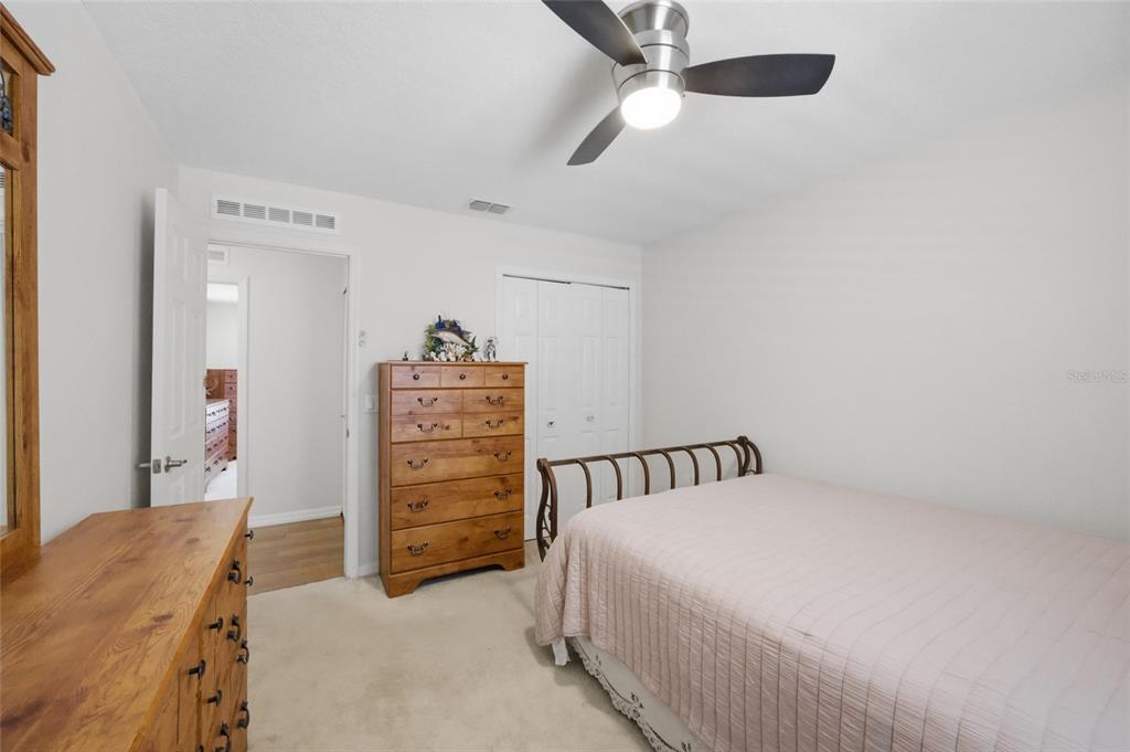 4517 Southeast 28th Street Ocala, FL 34480 - Photo 28 of 43 a bedroom with a bed and a dresser