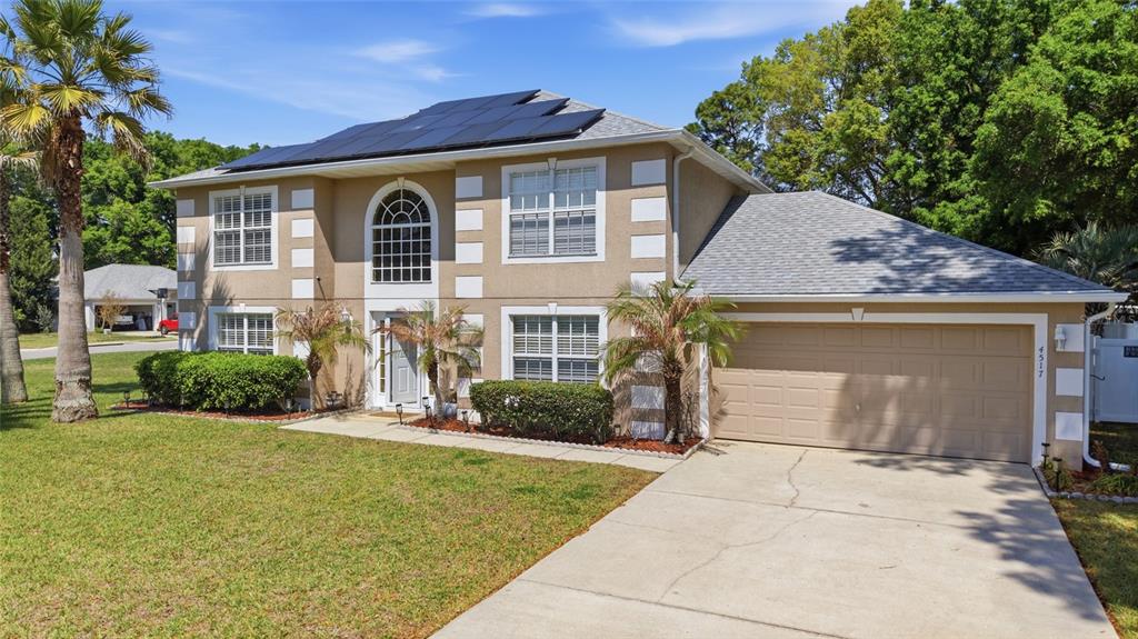 4517 Southeast 28th Street Ocala, FL 34480 - Photo 3 of 43 a front view of a house with garden