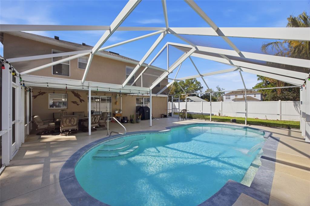 4517 Southeast 28th Street Ocala, FL 34480 - Photo 34 of 43 a view of a swimming pool with a patio