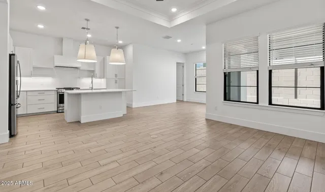 a kitchen with cabinets and steel stainless steel appliances