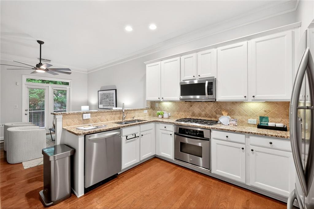 1982 Cobblestone Circle Northeast Brookhaven, GA 30319 - Photo 13 of 51 a kitchen with a sink stove and microwave