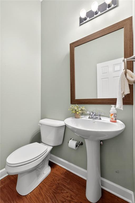 1982 Cobblestone Circle Northeast Brookhaven, GA 30319 - Photo 16 of 51 a bathroom with a sink a toilet and mirror