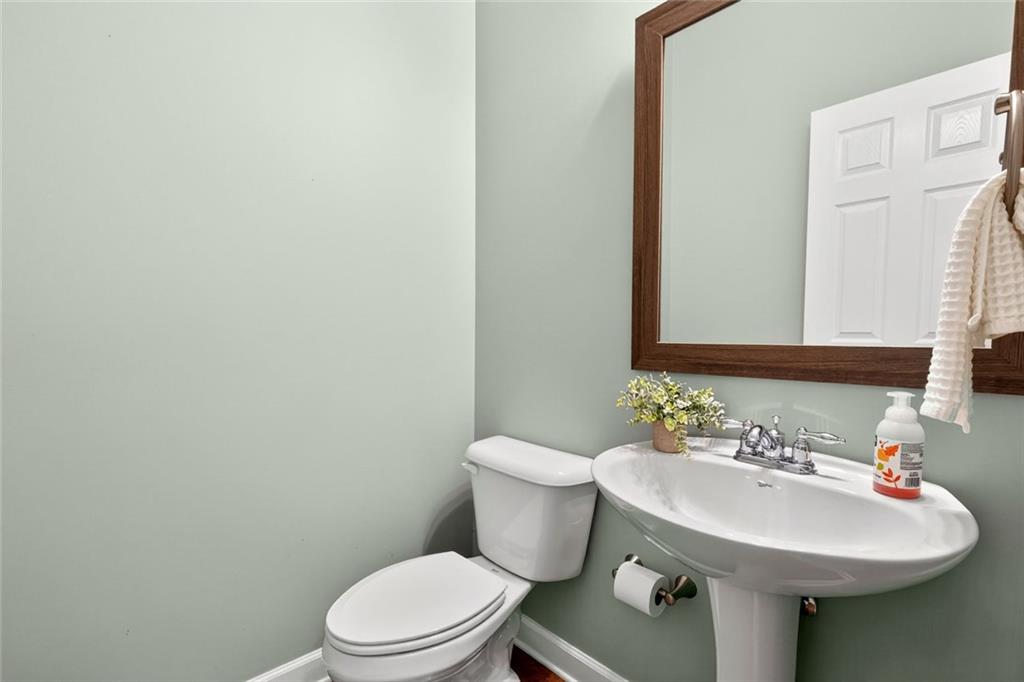 1982 Cobblestone Circle Northeast Brookhaven, GA 30319 - Photo 17 of 51 a bathroom with a sink a toilet and mirror