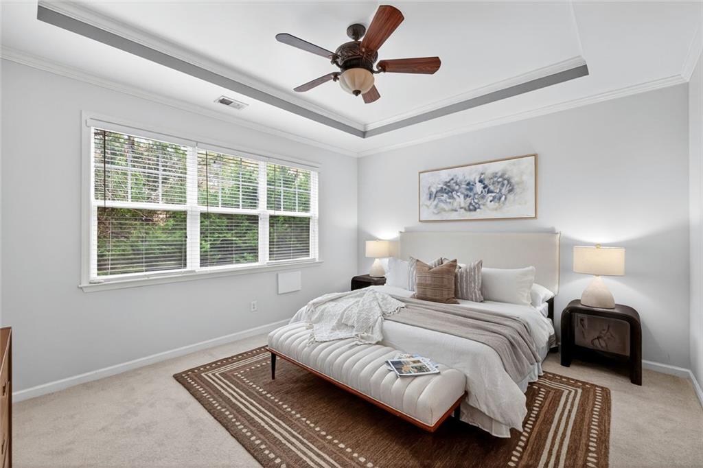 1982 Cobblestone Circle Northeast Brookhaven, GA 30319 - Photo 18 of 51 a bedroom with a bed and a window