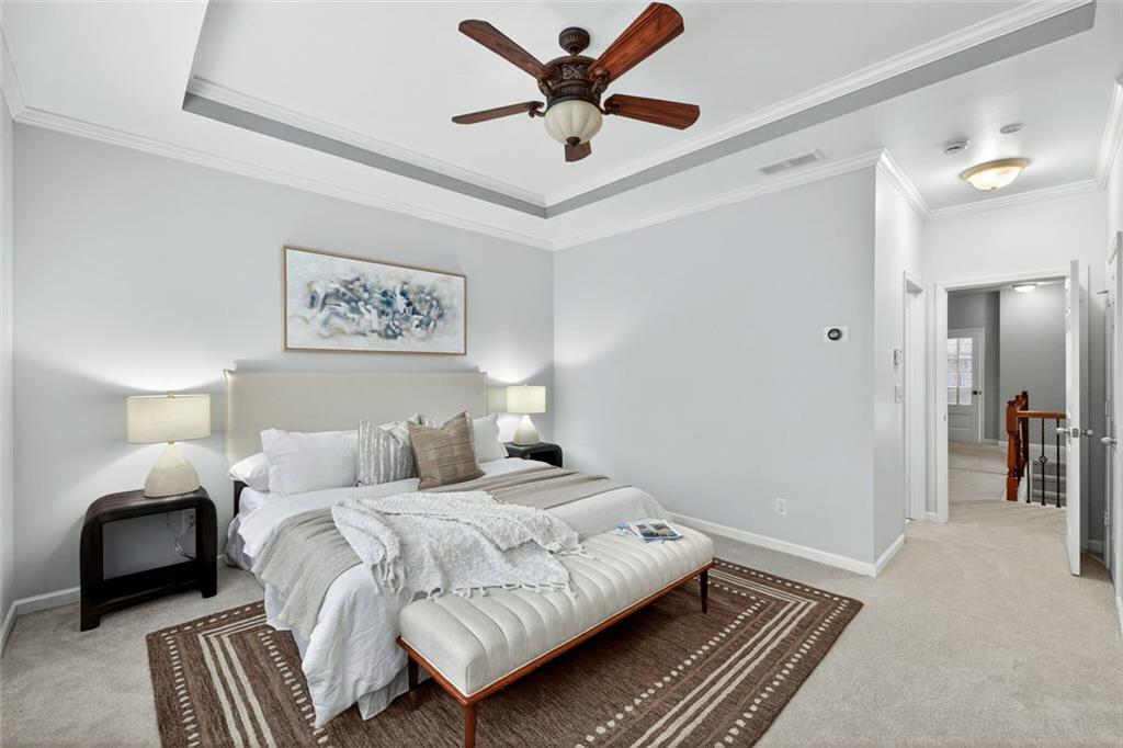 1982 Cobblestone Circle Northeast Brookhaven, GA 30319 - Photo 19 of 51 a bedroom with a bed and a chandelier