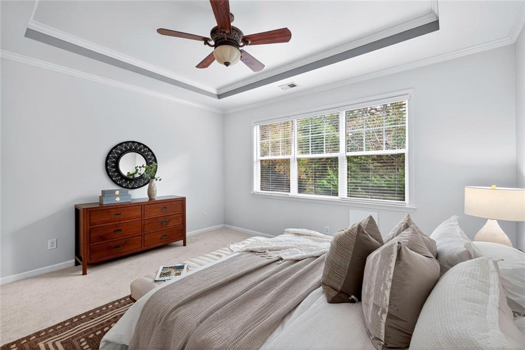 1982 Cobblestone Circle Northeast Brookhaven, GA 30319 - Photo 20 of 51 a bedroom with a bed and window