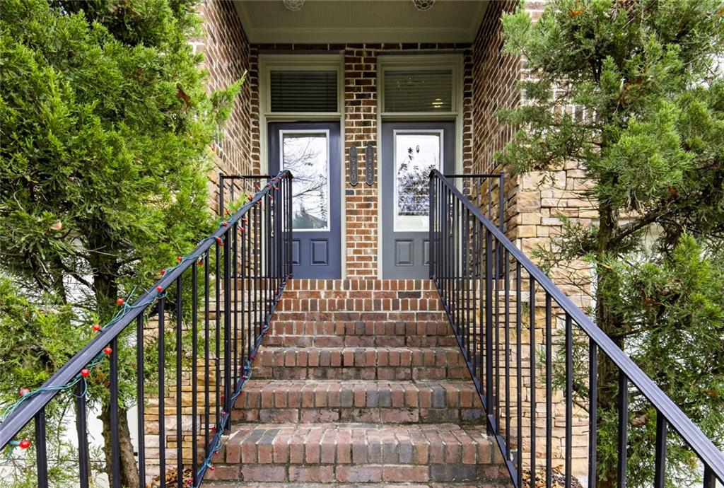 1982 Cobblestone Circle Northeast Brookhaven, GA 30319 - Photo 2 of 51 a view of staircase with railing and white walls