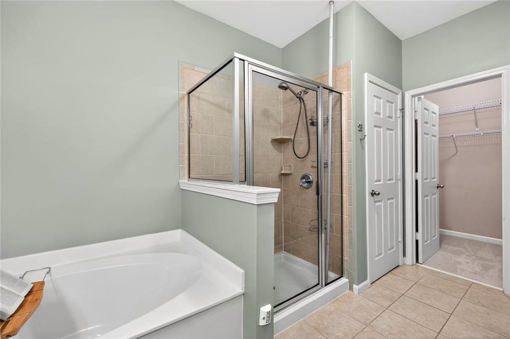 1982 Cobblestone Circle Northeast Brookhaven, GA 30319 - Photo 23 of 51 a bathroom with a shower and a tub