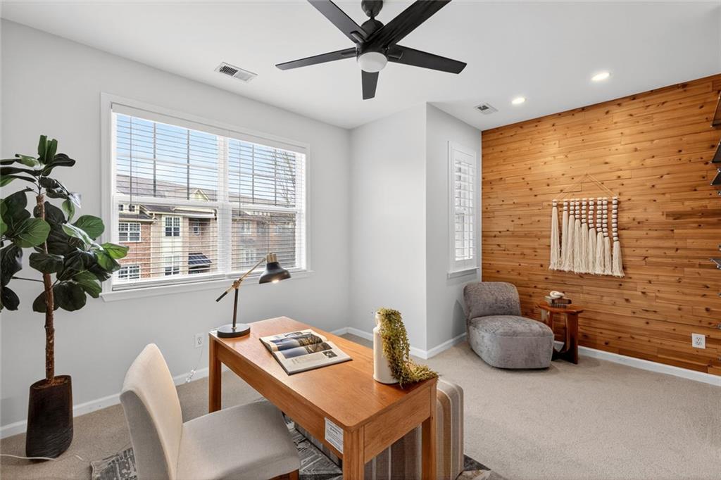 1982 Cobblestone Circle Northeast Brookhaven, GA 30319 - Photo 26 of 51 a living room with furniture and a potted plant