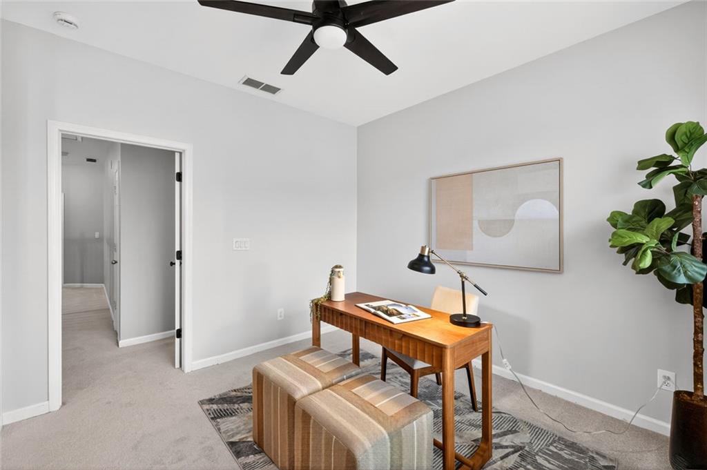 1982 Cobblestone Circle Northeast Brookhaven, GA 30319 - Photo 28 of 51 a living room with a couch and a potted plant