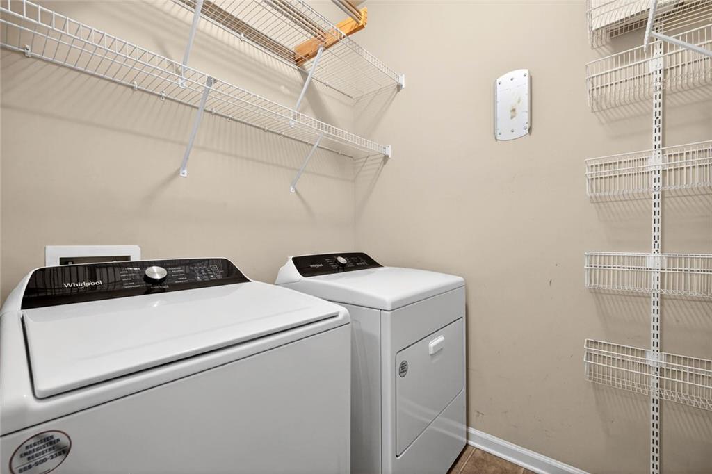 1982 Cobblestone Circle Northeast Brookhaven, GA 30319 - Photo 29 of 51 a utility room with dryer and washer