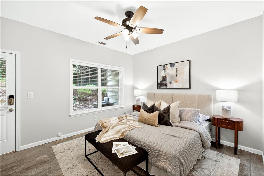 1982 Cobblestone Circle Northeast Brookhaven, GA 30319 - Photo 31 of 51 a bedroom with two beds and a window