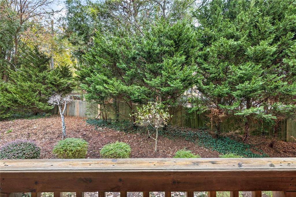 1982 Cobblestone Circle Northeast Brookhaven, GA 30319 - Photo 38 of 51 a small garden covered with tall trees
