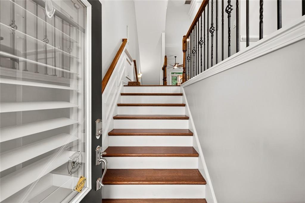 1982 Cobblestone Circle Northeast Brookhaven, GA 30319 - Photo 4 of 51 a view of staircase with wooden floor and white walls