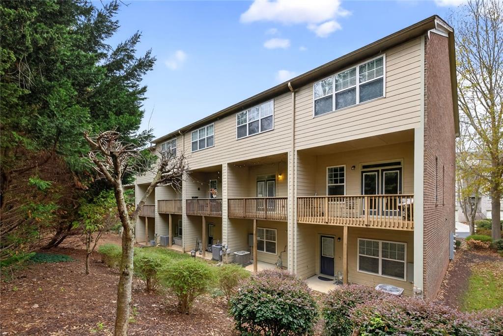 1982 Cobblestone Circle Northeast Brookhaven, GA 30319 - Photo 41 of 51 a front view of a house with a yard