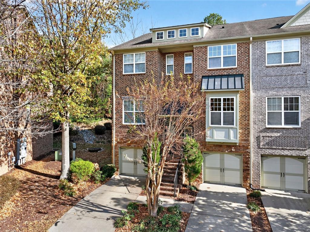 1982 Cobblestone Circle Northeast Brookhaven, GA 30319 - Photo 49 of 51 a front view of a house with garden