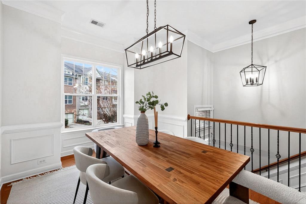 1982 Cobblestone Circle Northeast Brookhaven, GA 30319 - Photo 5 of 51 a view of a dining room with furniture window and wooden floor